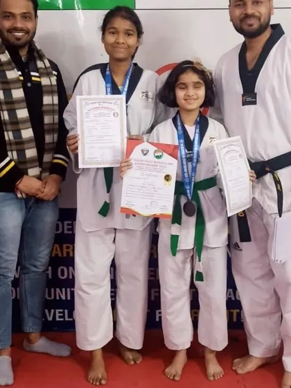 Proudly posing with our medalists. Their success is an inspiration to the entire academy.