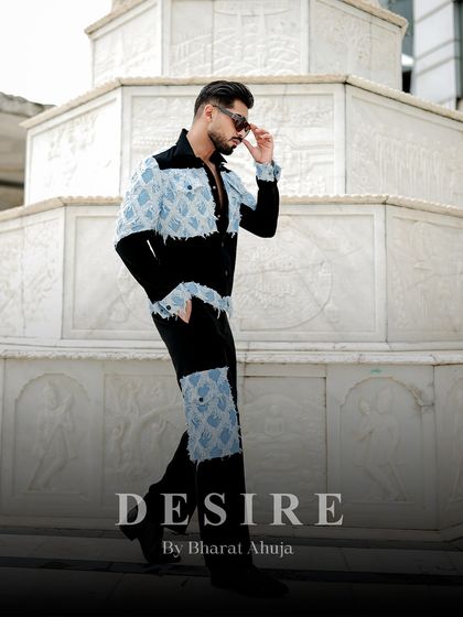 Walking with purpose. This side profile of the denim patchwork co-ord set shows how the design creates a dynamic and modern silhouette.