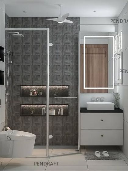 A sleek and modern toilet design using dark textured tiles in the shower area and a minimalist white vanity with an LED-backlit mirror.