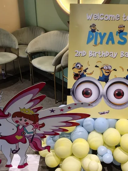 A custom welcome sign for Diya's 2nd birthday bash, featuring the lovable Minions. This is a great example of how we tie all the decor elements together, starting from the entrance.