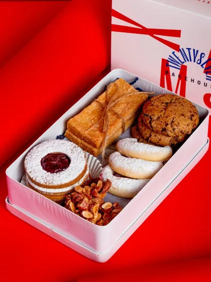 My Christmas Cookie Tin is the perfect holiday gift or retail item for your cafe. It's packed with five different classic holiday cookies from around the world.