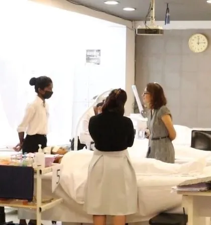 A glimpse into our CIBTAC examination process. Students perform advanced facial treatments on live models under the supervision of international examiners, ensuring they meet global standards.