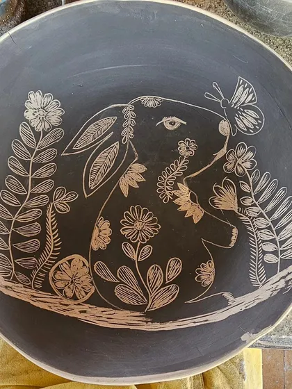 This piece is very close to my heart. I made this sgraffito shallow bowl in memory of my sweet pet rabbit, Sonu. Carving his likeness among the flowers was an emotional process, and it’s a reminder of how we can hold our loved ones in art.