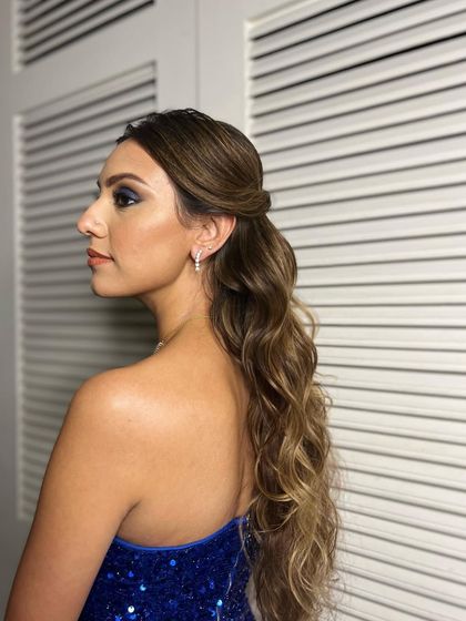 The final cocktail look from the side, showing the sleek top and the voluminous waves.