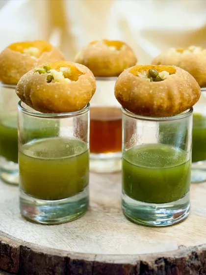 No Indian celebration is complete without Pani Puri. I serve these crispy spheres of joy in individual shot glasses, making them easy for guests to enjoy while mingling. It’s a classic street food favorite, elevated for your special event.