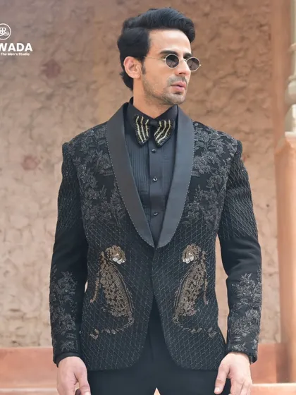 Unleash your wild side with this black tuxedo featuring an embroidered leopard motif. This piece from the Crown & Collar collection is for the man who is not afraid to stand out.