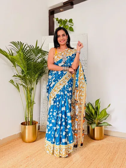 A beautiful blue Kalamkari print cotton Mulmul saree. This fabric is incredibly soft and breathable, making it my top choice for comfortable all-day wear.