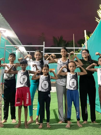 The kids' crew flexing after a great workout. The smiles on their faces say it all.