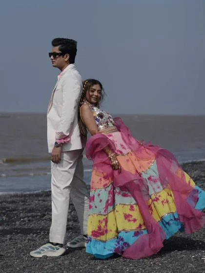 A stylish couple portrait on the beach during their carnival event. We help plan photoshoots that capture the theme and location of your celebrations.