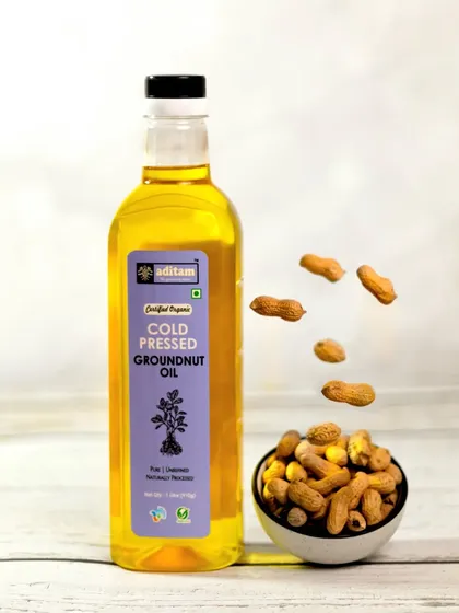 Levitation shots are my favorite. Here, peanuts appear to be floating into a bowl next to a bottle of cold-pressed groundnut oil, creating a dynamic and playful visual that is sure to catch the eye.