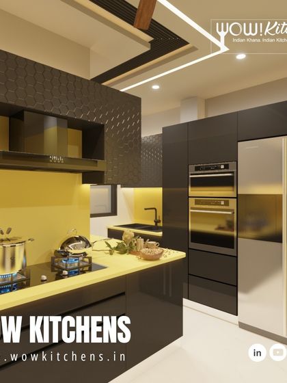 The integrated refrigerator and double ovens are seamlessly built into the cabinetry in this striking black and yellow kitchen, demonstrating our commitment to both form and function.