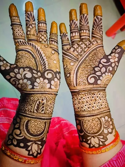 The back of the hands for the same design, continuing the floral and geometric themes.