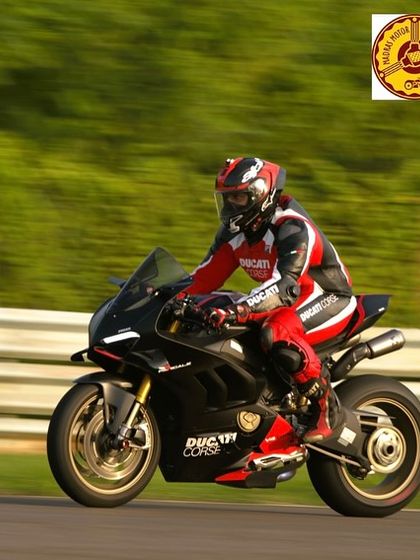A black Ducati Panigale V4 Corse edition on the move. These track days are a great opportunity for owners to truly experience what their bikes were built for.