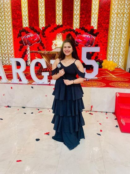 What brings the 'spark' to your event? A perfect anchor. Posing at a 5th birthday party with a 'Cars' theme.