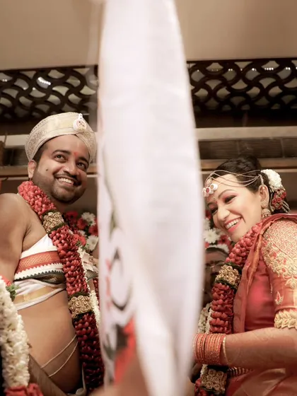 The "first look" moment, where the curtain is dropped and the bride and groom see each other. The genuine smiles and anticipation make this a magical shot.