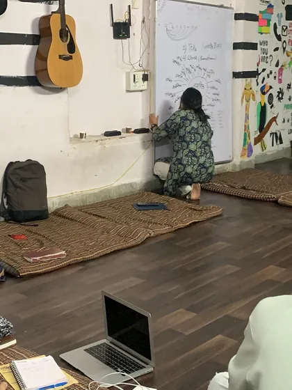 A student writes on the whiteboard during a "Be a Jagrik" session. We encourage active participation and youth-led discussions on constitutional values.