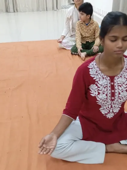 A young seeker sits with remarkable stillness. It is inspiring to see people begin their spiritual journey at any age.