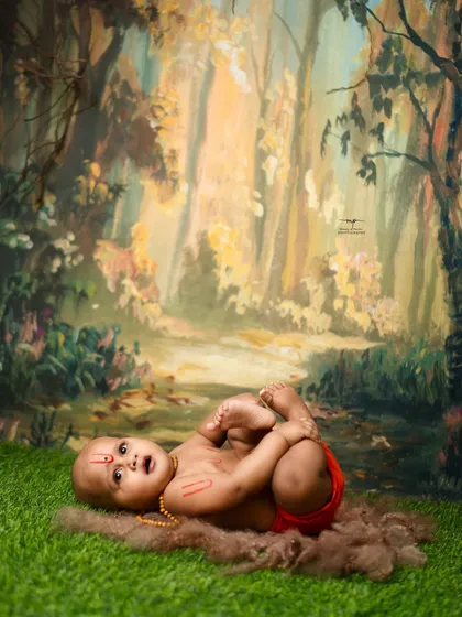 A playful pose from our little Swami Samarth. The natural, earthy tones of the setup complement the spiritual theme of the photoshoot.