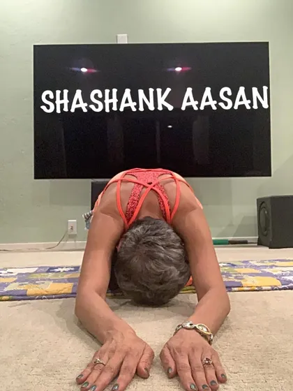 Shashank Aasan, or Hare Pose, is a variation of Child's Pose that provides a deeper stretch for the upper back.