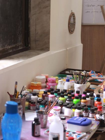 Welcome to the mess! This is my paint station where all the hand-painting happens. It's a bit chaotic, but it's where the color and magic come together for every custom piece.