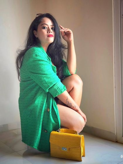 A bold green blazer makes a powerful statement. I teach clients how to use color strategically in their professional wardrobe to convey energy, creativity, and confidence.