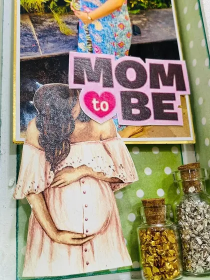 A beautiful illustration of a 'Mom to Be' cradling her bump, adding an artistic and emotional touch to the baby shower frame.