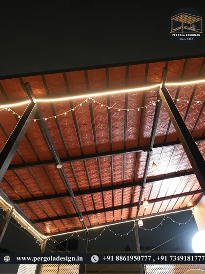 A close-up of the Mangalore tile ceiling with integrated LED strip lighting and decorative string lights. This combination of traditional materials and modern lighting creates a unique and festive ambiance.