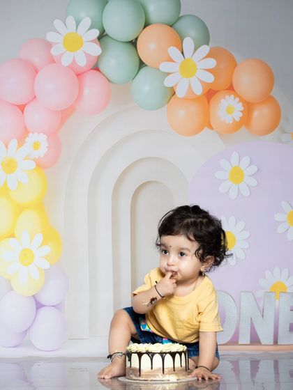 A thoughtful moment amidst the cake chaos. This baby is contemplating his next move.
