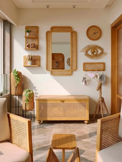 A full view of the cozy boho balcony, where every element is chosen to create a relaxed and stylish vibe. The rattan chairs, wooden chest, and wall decor all work together to make this the perfect spot to enjoy the sea breeze.