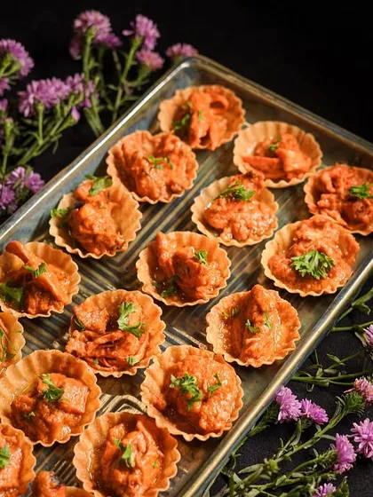 Another look at my popular Creamy Butter Chicken Tarts. The vibrant color and fresh cilantro garnish make them as beautiful as they are delicious.