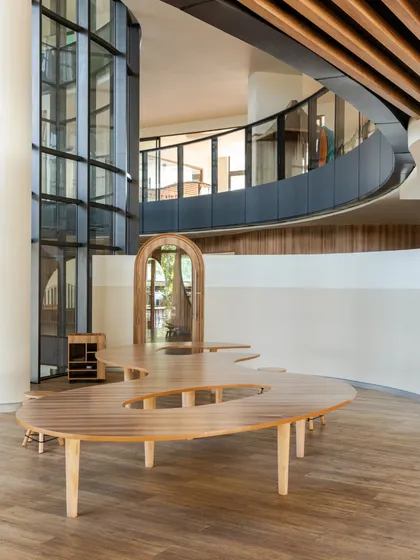 At Vedanya School, Gurugram, a compact site inspired an imaginative design. Curved forms, double-height volumes, and layered connections create an interconnected environment that encourages movement and exploration for young learners.