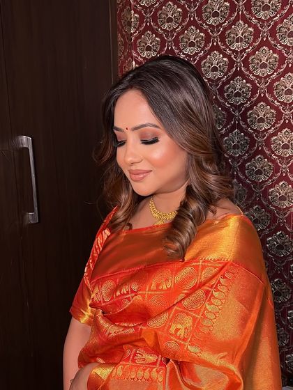 A side profile of the Kanjivaram saree look. The soft curls and ethereal makeup create a look that is one of my all-time favorites.