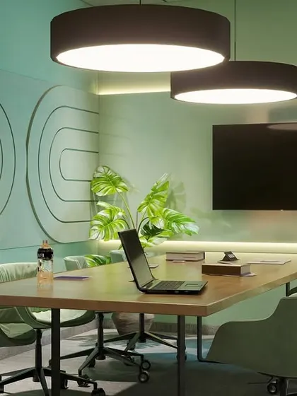 This meeting room concept uses a calming mint green palette. The custom wall panels with their soft, curved patterns and comfortable seating create a refreshing space for productive discussions.