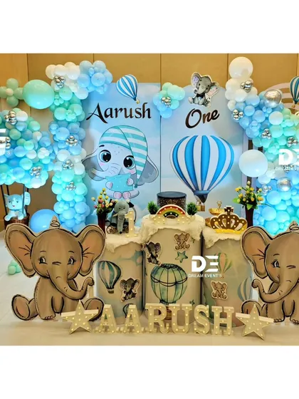 A full view of an adorable baby elephant theme, one of my most popular choices for a boy's first birthday. I combine cute character cutouts, cloud-like balloon arrangements, and personalized name displays for a dreamy sky-high adventure.