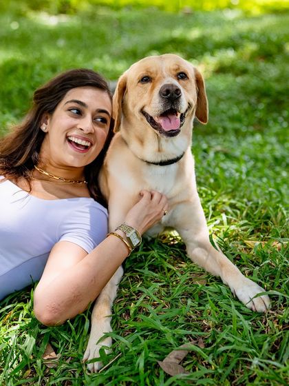 A joyful, candid shot of me and my dog Prancer relaxing in the grass. This is the kind of authentic, happy moment I love to capture for my clients.