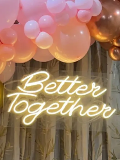 A close-up of the custom neon sign, which can be personalized with any message or name for your event.