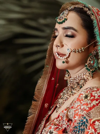 A serene, close-up portrait of the bride with her eyes closed, capturing a moment of peace and contemplation on her wedding day.
