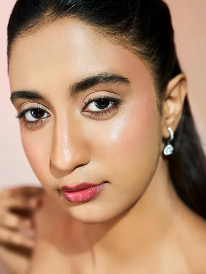 This portrait showcases a beautiful, natural-looking base. The skin is even and radiant, with a soft blush to add a touch of color.