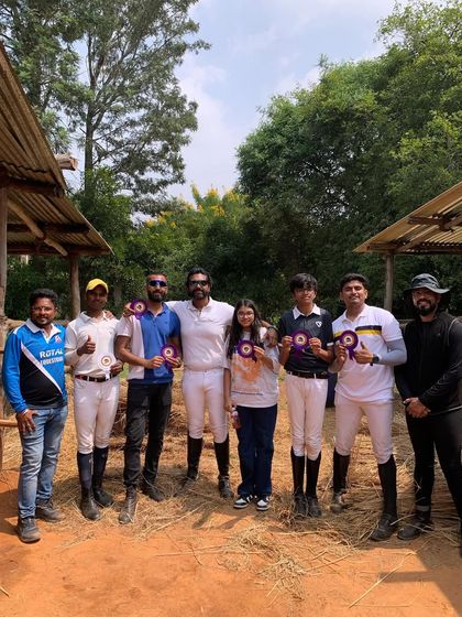 Team Royal after a successful day at the EPL Show. The smiles on their faces show the pride and joy of competing and achieving their goals together.