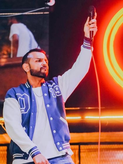 Me on the mic during the Rock & Dhol night, ready to hype the crowd.