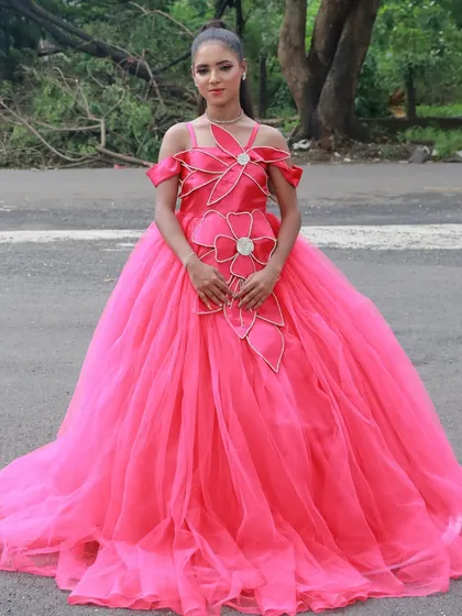 A bold, hot pink gown with makeup to match. Our students are not afraid to work with color.