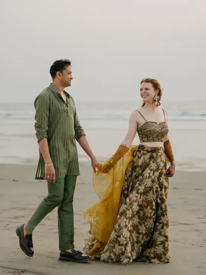 For Rachael and Viraj's Goa wedding, we styled a bohemian-inspired sundowner on the beach. We chose an earthy, tone-on-tone palette with an olive green sheer kurta for him and a floral organza lehenga for her, proving that wedding events can be both relaxed and incredibly chic.