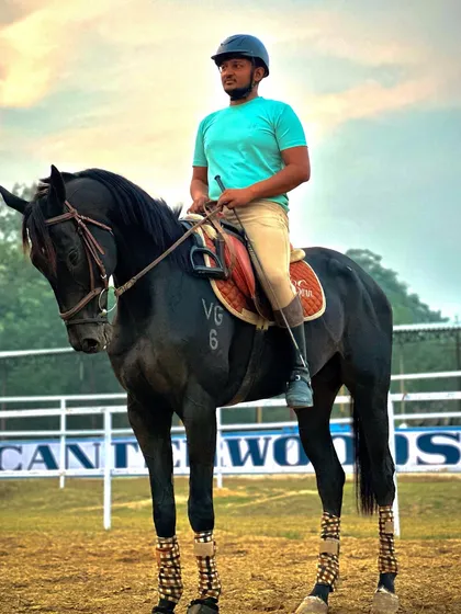 A rider sits tall and confident on his horse, demonstrating the proper posture taught by our instructors. The "Chin Up Heels Down" mantra is key to good riding.
