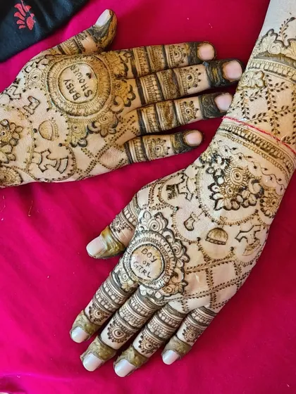Another angle of the 'Boy or Girl?' baby shower mehendi. The design is filled with festive elements like balloons and rattles, making it very thematic.