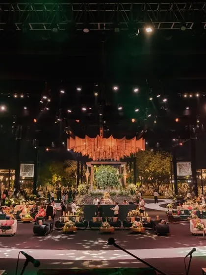 The full scale of the musical-themed reception, with its grand structures, suspended decor elements, and multiple lounge areas, all designed to tell a cohesive story.