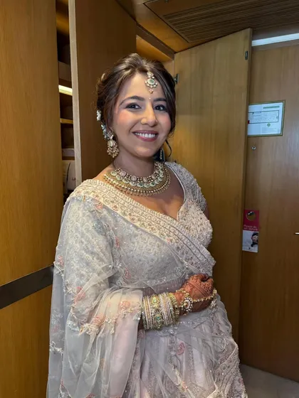 A close-up portrait showing the soft, minimal approach to her makeup. The look is fresh and modern, perfect for a bride who wants to look like the best version of herself.