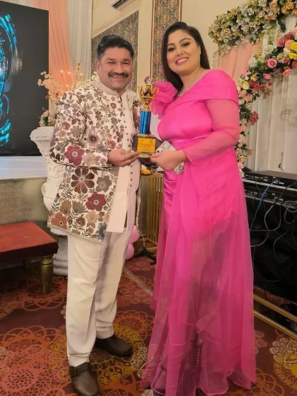 Even celebrities choose to rent for their big events. Here's a client looking stunning in a bright pink gown, proving that renting is both smart and stylish.