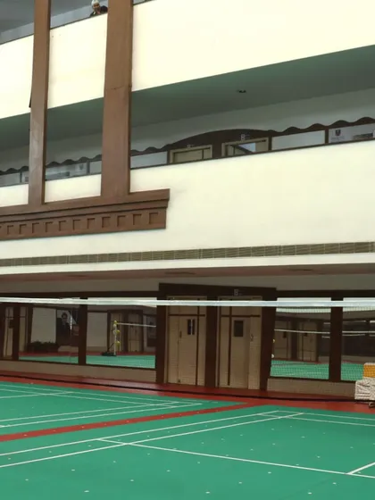 A side view of the court area, showing the clean lines and spacious surroundings. We ensure our academy is always in top condition for our players.