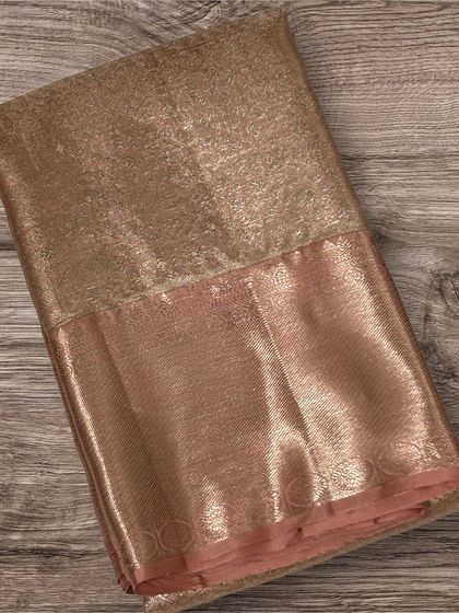 A beautiful rose gold tissue Kanchi silk saree.