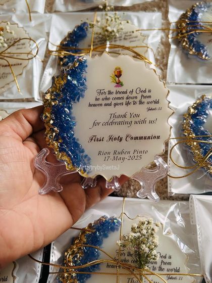 Some gifts are more than keepsakes; they're blessings. Holding one of the First Holy Communion favors, which traveled to Dubai for a sacred celebration.